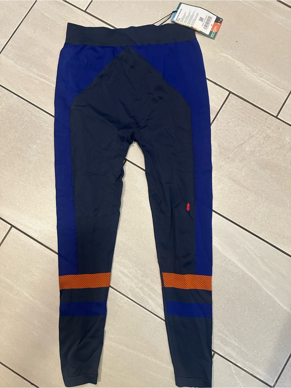 cotopaxi Navy and Royal Blue seamless baselayer tight with Orange Accents